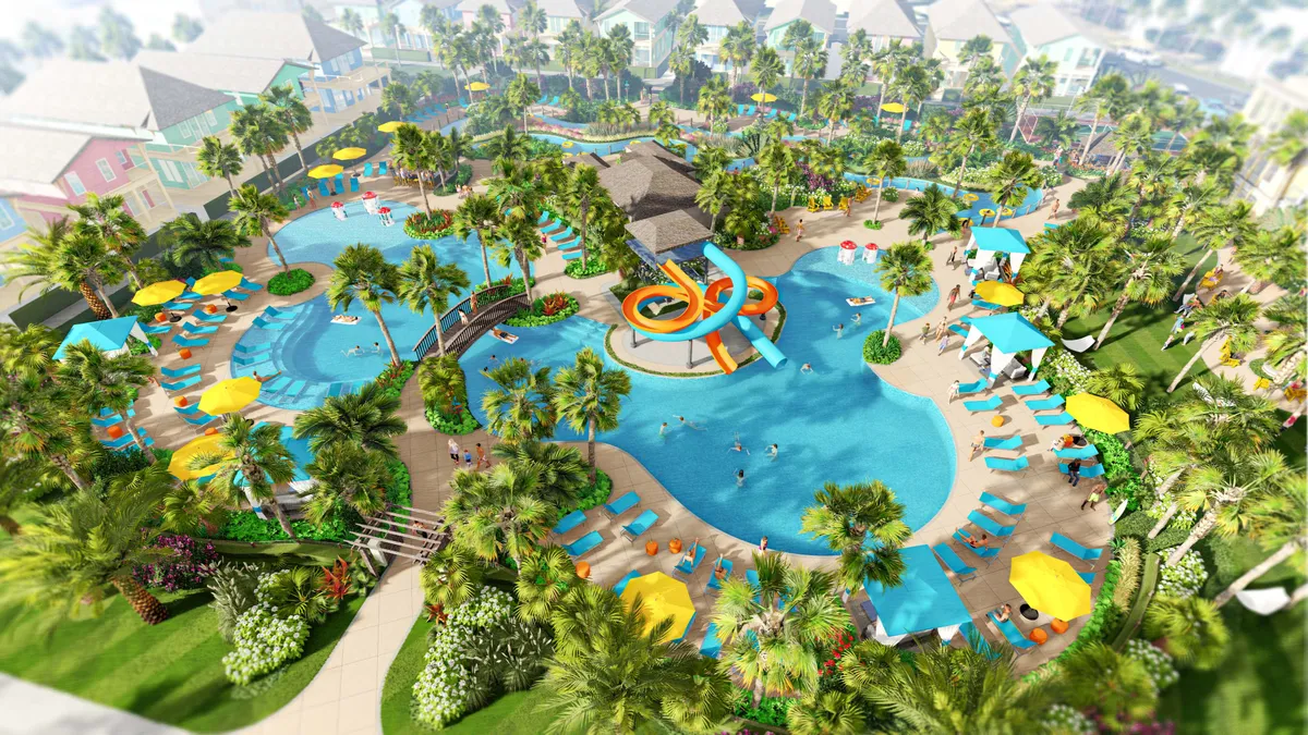 The image features a large resort pool with winding lazy river, colorful water slides, and poolside lounge chairs topped with vibrant umbrellas. Lush palm trees and greenery frame the energetic atmosphere, while families and children enjoy various water activities and relaxation spots.